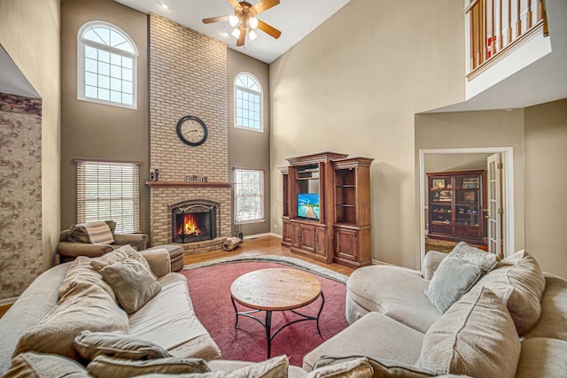 541 Clover Dr, Algonquin, IL 60102 - living area featuring a high ceiling, ceiling fan, wood finished floors, and a brick fireplace