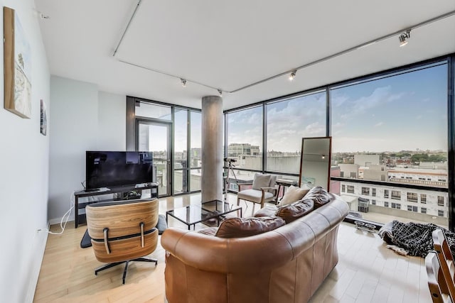 860 W Blackhawk St Unit 805, Chicago, IL 60642 - living room with rail lighting, floor to ceiling windows, and light wood finished floors