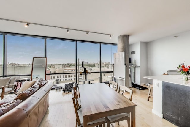 860 W Blackhawk St Unit 805, Chicago, IL 60642 - dining room featuring track lighting, light wood-style flooring, and floor to ceiling windows
