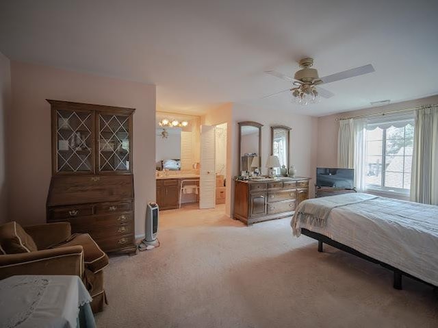 8125 Willow Dr Unit C, Palos Hills, IL 60465 - bedroom featuring light colored carpet, ceiling fan, a chandelier, and connected bathroom