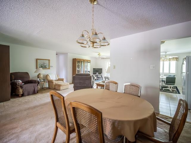 8125 Willow Dr Unit C, Palos Hills, IL 60465 - carpeted dining space featuring a chandelier and a textured ceiling