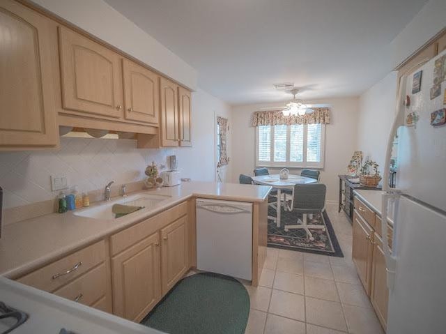 8125 Willow Dr Unit C, Palos Hills, IL 60465 - kitchen with white appliances, a peninsula, light brown cabinetry, light countertops, and light tile patterned flooring