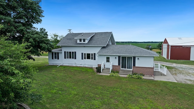 18521 Anderson Rd, Prophetstown, IL 61277 - rear view of property featuring a lawn and roof with shingles