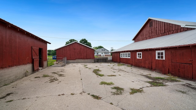 18521 Anderson Rd, Prophetstown, IL 61277 - view of side of home featuring an outbuilding and a metal roof