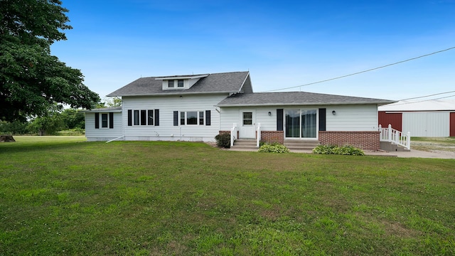 18521 Anderson Rd, Prophetstown, IL 61277 - view of front of property featuring a front lawn, a shingled roof, brick siding, and entry steps