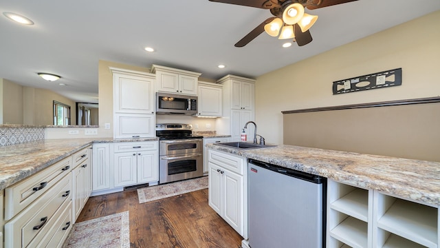 18521 Anderson Rd, Prophetstown, IL 61277 - kitchen featuring stainless steel appliances, a ceiling fan, recessed lighting, light stone counters, and dark wood-style floors