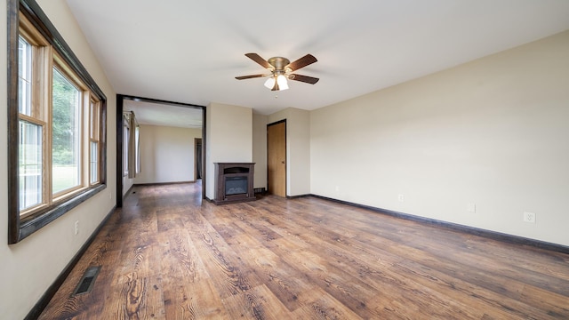 18521 Anderson Rd, Prophetstown, IL 61277 - unfurnished living room with wood finished floors and ceiling fan