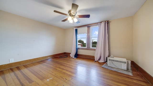 18521 Anderson Rd, Prophetstown, IL 61277 - empty room featuring wood finished floors, ceiling fan, and a wall mounted air conditioner