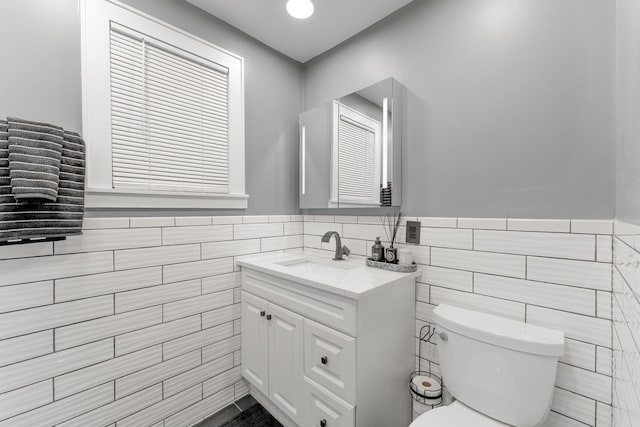 2610 N Major Ave, Chicago, IL 60639 - bathroom with vanity, tile walls, and a wainscoted wall
