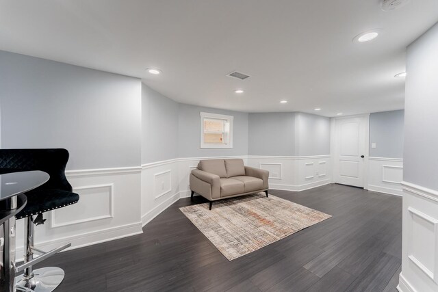 2610 N Major Ave, Chicago, IL 60639 - living area with wainscoting, dark wood-type flooring, recessed lighting, and a decorative wall
