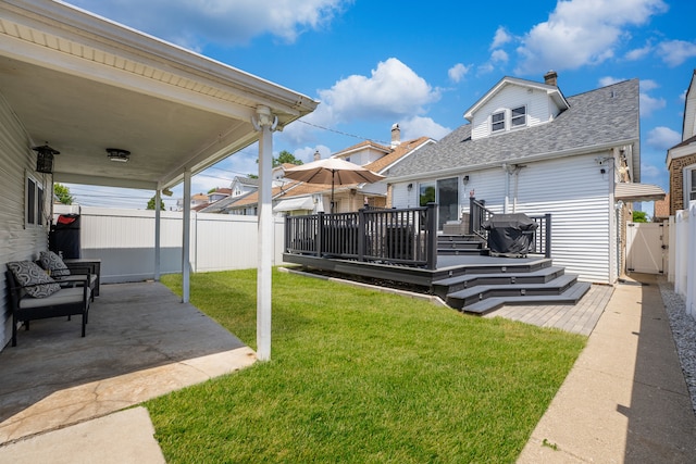 2610 N Major Ave, Chicago, IL 60639 - fenced backyard featuring a patio area, a wooden deck, and a gate