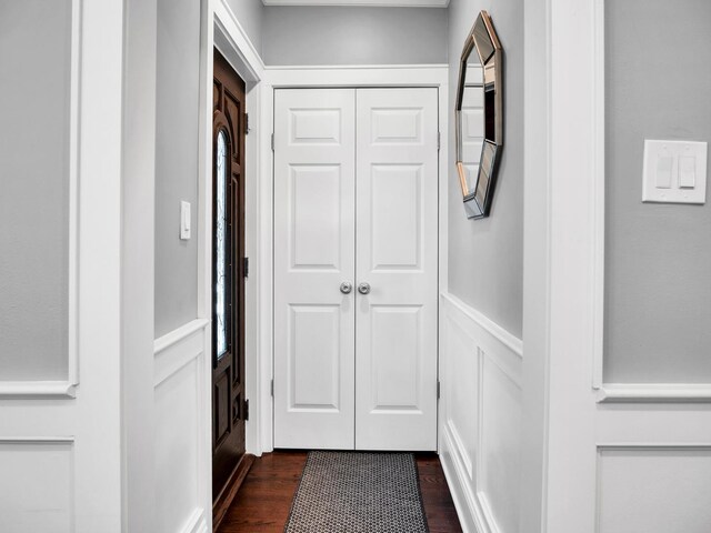 2610 N Major Ave, Chicago, IL 60639 - hall with dark wood-style floors, a decorative wall, and wainscoting