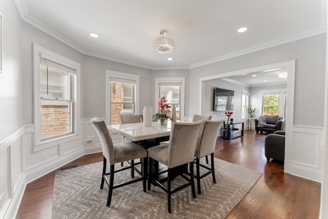 2610 N Major Ave, Chicago, IL 60639 - dining area with dark wood-style flooring, a chandelier, wainscoting, recessed lighting, and a decorative wall