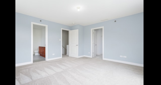 1420 Broadway St Unit 1420, Blue Island, IL 60406 - unfurnished bedroom featuring light colored carpet, a spacious closet, and ensuite bath