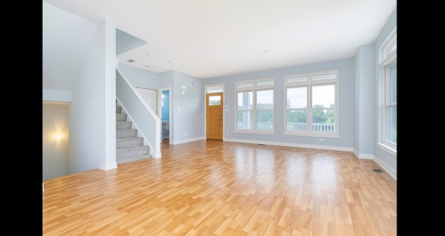 1420 Broadway St Unit 1420, Blue Island, IL 60406 - unfurnished living room with light wood-style floors and stairway