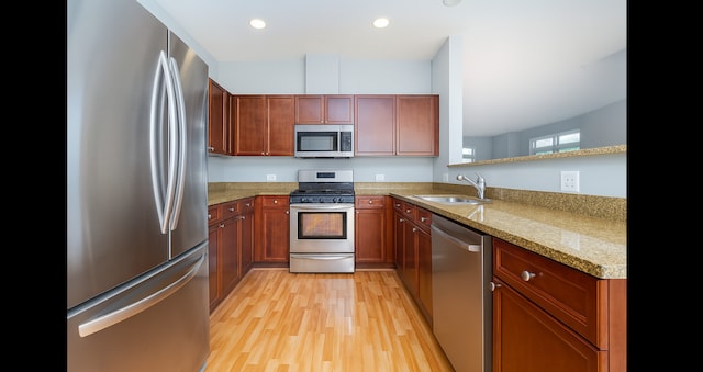 1420 Broadway St Unit 1420, Blue Island, IL 60406 - kitchen featuring appliances with stainless steel finishes, light wood-style floors, recessed lighting, brown cabinetry, and light stone countertops