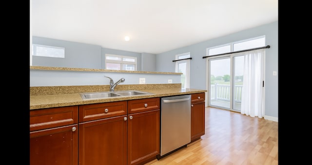 1420 Broadway St Unit 1420, Blue Island, IL 60406 - kitchen with dishwasher, light countertops, brown cabinetry, and light wood-style floors