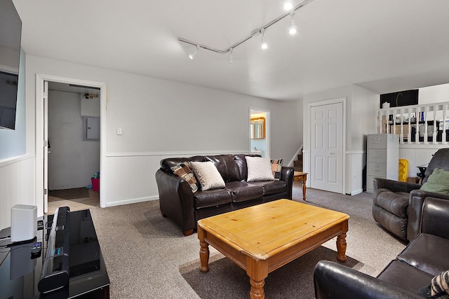 5551 143rd St, Midlothian, IL 60445 - carpeted living area with track lighting, a wainscoted wall, stairway, and electric panel