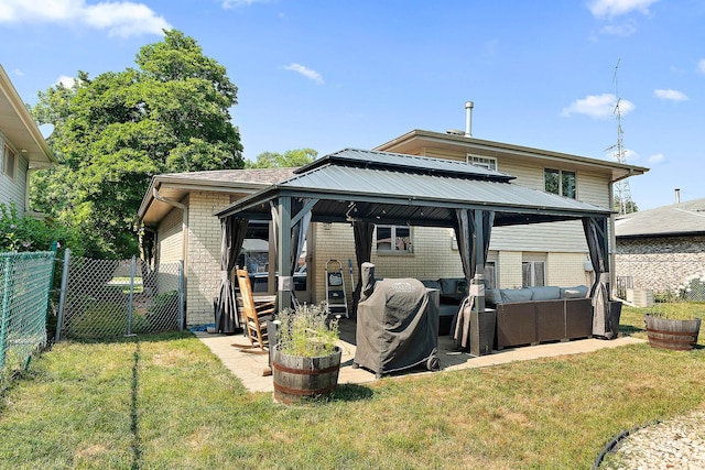 5551 143rd St, Midlothian, IL 60445 - rear view of property featuring a gazebo, outdoor lounge area, brick siding, and a patio