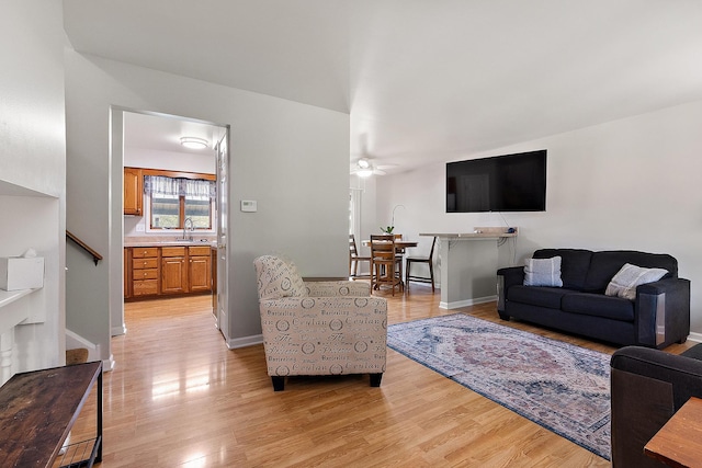 5551 143rd St, Midlothian, IL 60445 - living area with light wood-type flooring, a ceiling fan, and stairway