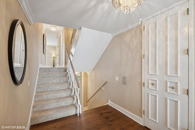 1500 Sheridan Rd Unit 7G, Wilmette, IL 60091 - staircase featuring wood finished floors, ornamental molding, and a chandelier