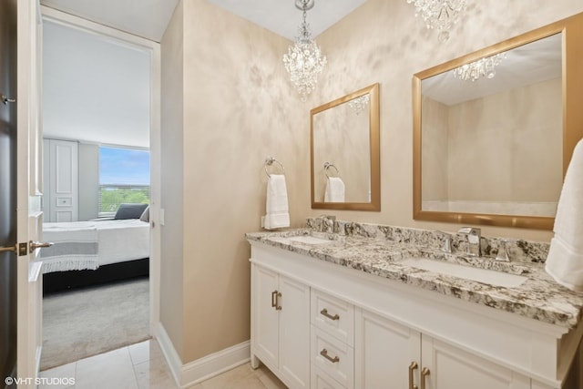 1500 Sheridan Rd Unit 7G, Wilmette, IL 60091 - ensuite bathroom featuring double vanity, a chandelier, and tile patterned floors