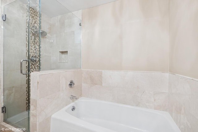 1500 Sheridan Rd Unit 7G, Wilmette, IL 60091 - bathroom featuring a bath and a shower stall