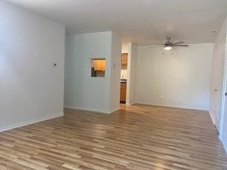 1486 Stonebridge Cir Unit A3, Wheaton, IL 60189 - unfurnished room with ceiling fan and wood finished floors