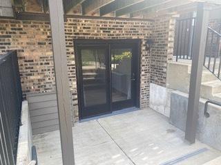 1486 Stonebridge Cir Unit A3, Wheaton, IL 60189 - property entrance with brick siding