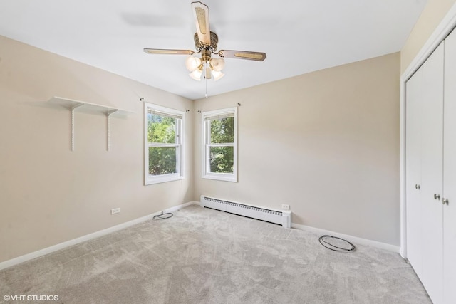 200 Eastwood Ct, Port Barrington, IL 60010 - unfurnished bedroom with a baseboard radiator, carpet flooring, a closet, and a ceiling fan