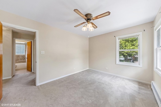 200 Eastwood Ct, Port Barrington, IL 60010 - carpeted empty room with a baseboard heating unit and a ceiling fan