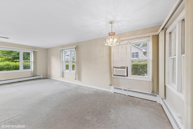 200 Eastwood Ct, Port Barrington, IL 60010 - empty room with a baseboard heating unit, plenty of natural light, carpet flooring, and a chandelier