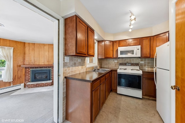 200 Eastwood Ct, Port Barrington, IL 60010 - kitchen with white appliances, brown cabinetry, backsplash, and a brick fireplace
