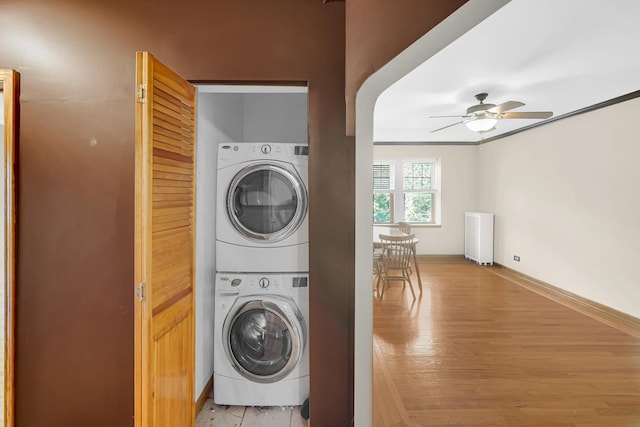 10911 S Longwood Dr Unit 2, Chicago, IL 60643 - washroom featuring stacked washer / drying machine, a ceiling fan, light wood-style flooring, and ornamental molding