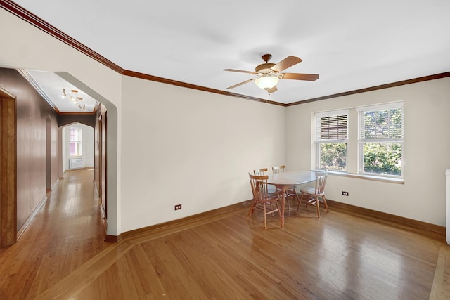 10911 S Longwood Dr Unit 2, Chicago, IL 60643 - dining area featuring light wood finished floors, arched walkways, ornamental molding, and ceiling fan
