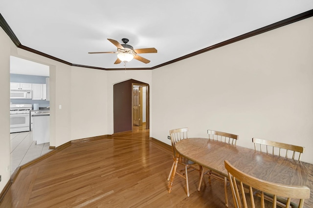 10911 S Longwood Dr Unit 2, Chicago, IL 60643 - dining area with ceiling fan, ornamental molding, arched walkways, and light wood-type flooring