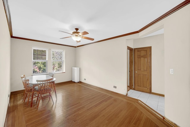 10911 S Longwood Dr Unit 2, Chicago, IL 60643 - dining room with light wood finished floors, a ceiling fan, and ornamental molding