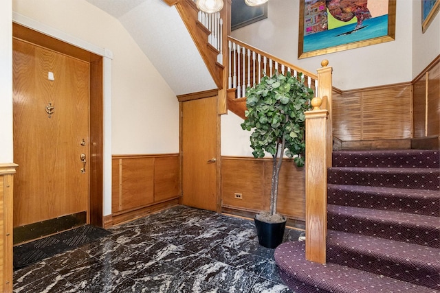 4744 S Prairie Ave Unit 1A, Chicago, IL 60615 - staircase featuring a wainscoted wall and vaulted ceiling