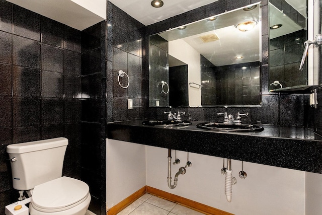 4744 S Prairie Ave Unit 1A, Chicago, IL 60615 - full bath featuring tile walls, tile patterned floors, double vanity, and backsplash