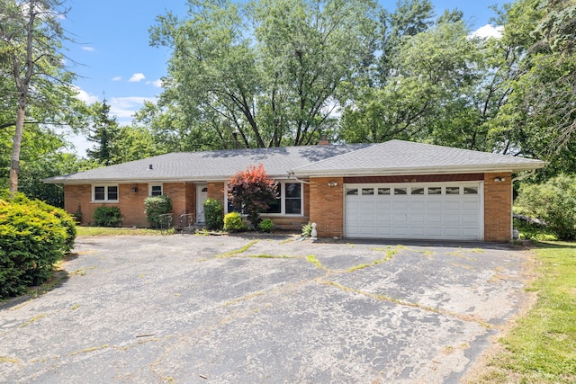 7942 Tennessee Ave, Willowbrook, IL 60527 - ranch-style house with driveway, brick siding, an attached garage, and a shingled roof