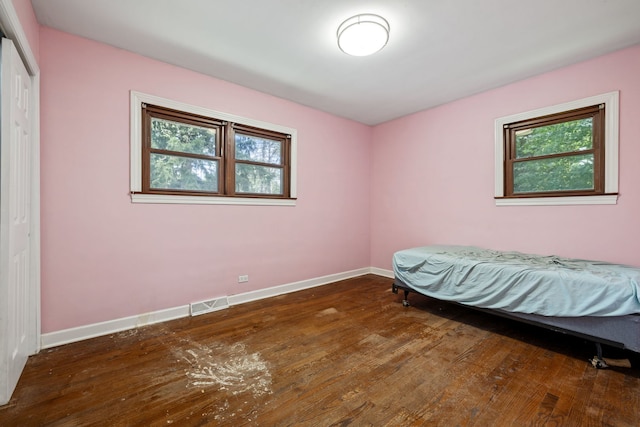 7942 Tennessee Ave, Willowbrook, IL 60527 - bedroom with hardwood / wood-style floors and a closet