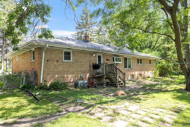 7942 Tennessee Ave, Willowbrook, IL 60527 - back of property featuring brick siding and a chimney
