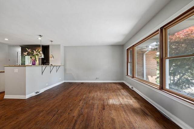 7942 Tennessee Ave, Willowbrook, IL 60527 - unfurnished living room with dark wood-style floors and recessed lighting