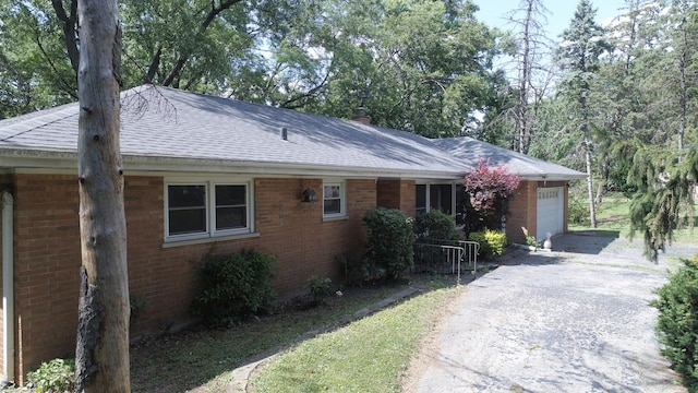 7942 Tennessee Ave, Willowbrook, IL 60527 - single story home featuring a shingled roof, brick siding, a garage, and asphalt driveway