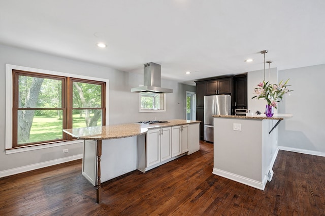 7942 Tennessee Ave, Willowbrook, IL 60527 - kitchen with extractor fan, stainless steel appliances, light stone counters, dark wood-type flooring, and a center island
