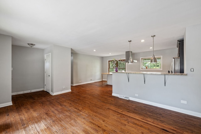 7942 Tennessee Ave, Willowbrook, IL 60527 - unfurnished living room featuring dark wood-style flooring and recessed lighting