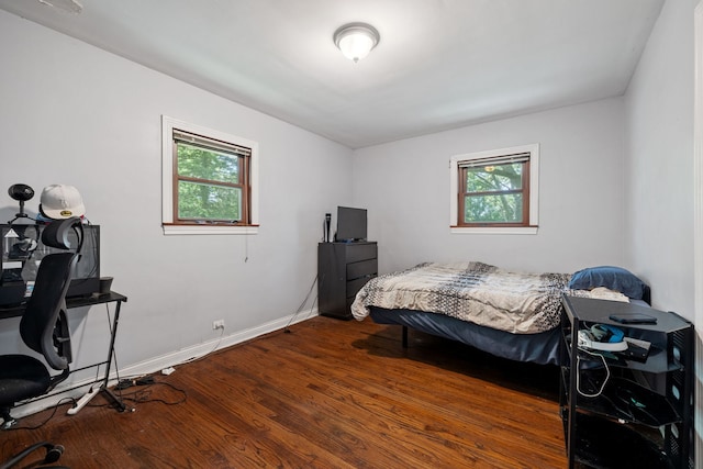7942 Tennessee Ave, Willowbrook, IL 60527 - bedroom featuring multiple windows, a desk, and dark wood-type flooring