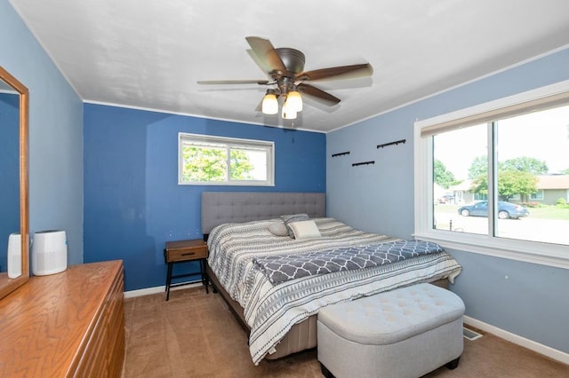 8882 S Main St, Hometown, IL 60456 - carpeted bedroom featuring multiple windows, a ceiling fan, and crown molding