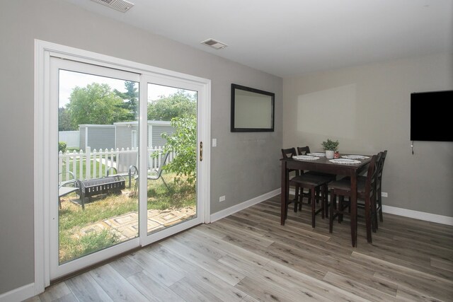 446 Northampton Ln, Roselle, IL 60172 - dining area with light wood finished floors and baseboards