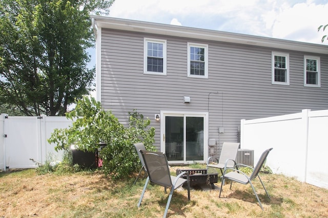 446 Northampton Ln, Roselle, IL 60172 - back of property featuring an outdoor fire pit and a fenced backyard